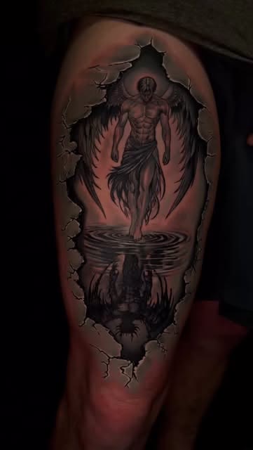 Angel breaking through skin tattoo by Carlos Tattoo in Tallahassee