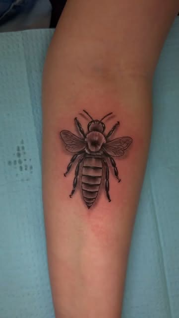 Micro realism bee tattoo by Carlos Tattoo in Tallahassee