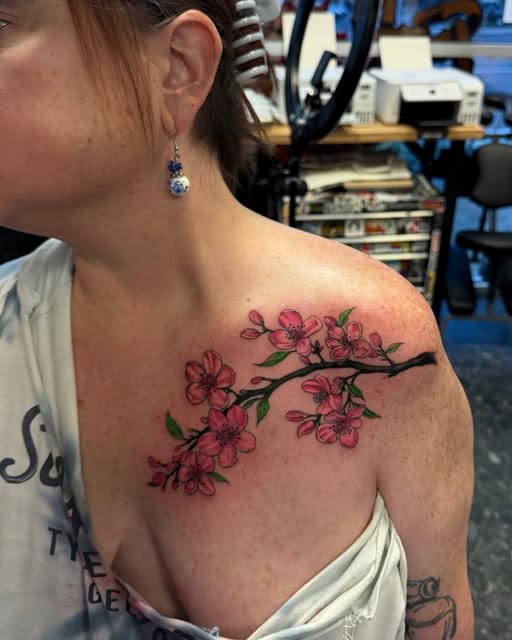 Cherry blossom branch tattoo by Carlos Tattoo in Tallahassee