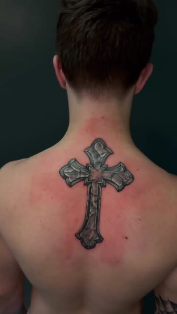 Stone cross tattoo by Carlos Tattoo in Tallahassee