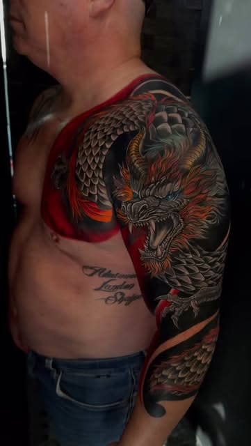 Japanese dragon sleeve tattoo by Carlos Tattoo in Tallahassee