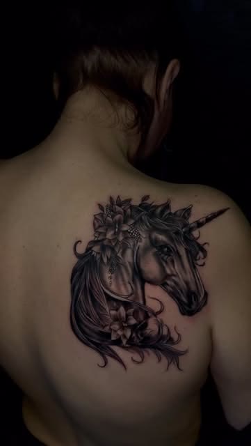 Unicorn portrait tattoo by Carlos Tattoo in Tallahassee